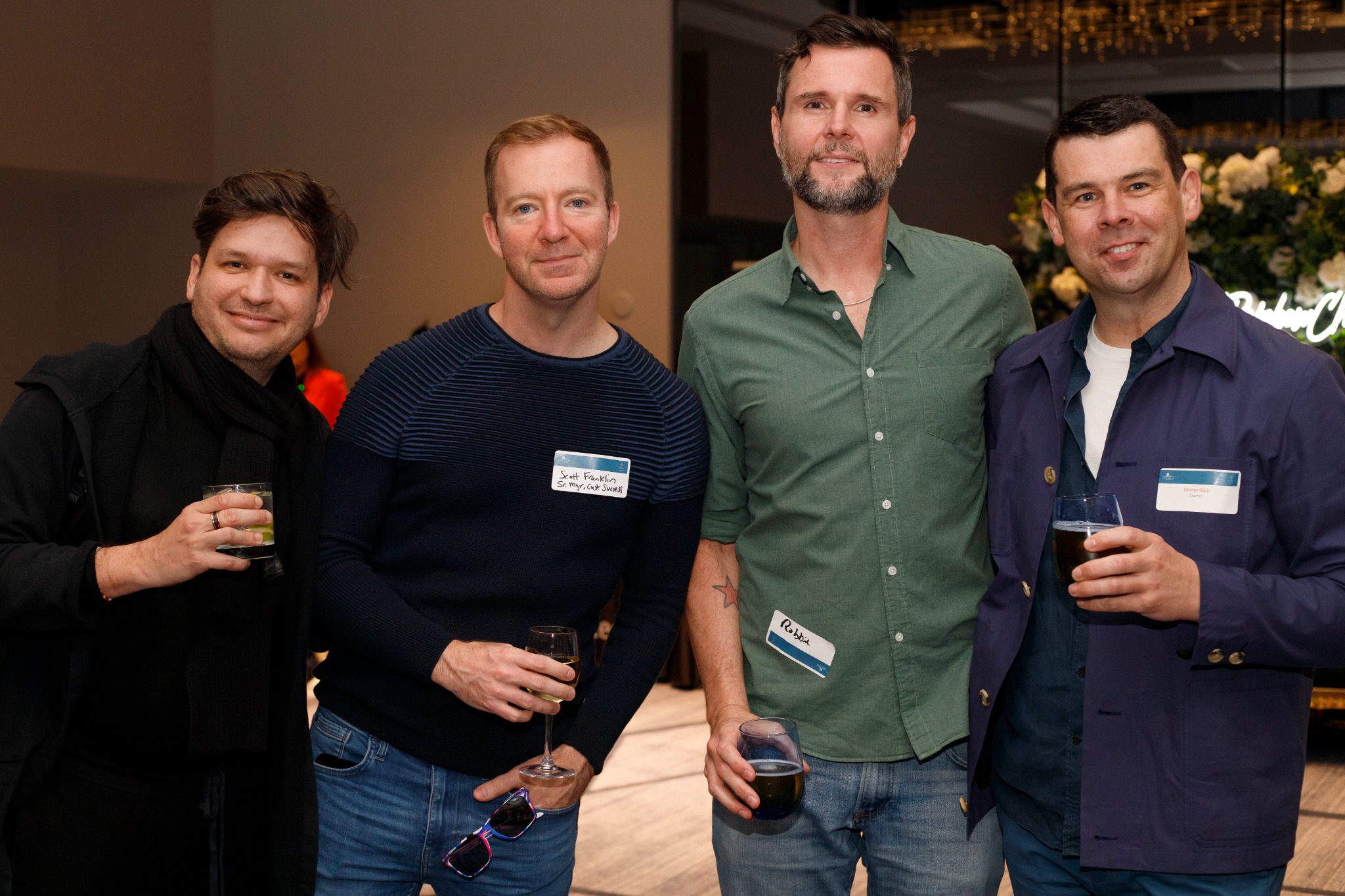 Four attendees enjoying a networking event